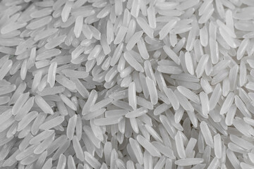 Close up of dry raw white rice background.  Macro top view of uncooked grain. Traditional food meal or ingredient of asian culture.