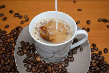 Morning coffee with coffee beans in the picture