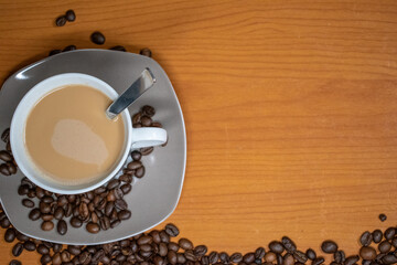 Morning coffee with coffee beans in the picture