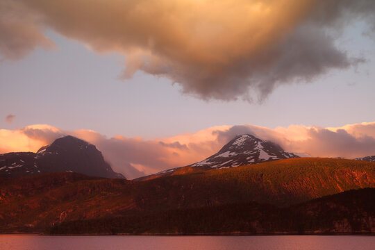 Mountains at dawn above Nordfjorden in Oldedalen Valley, near Olden, Vestland, Norway