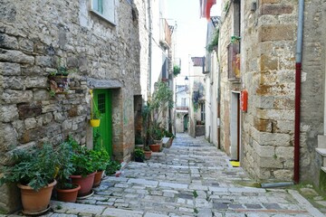 A narrow street among the old houses of Civitacampomarano, a historic town in the state of Molise in Italy.