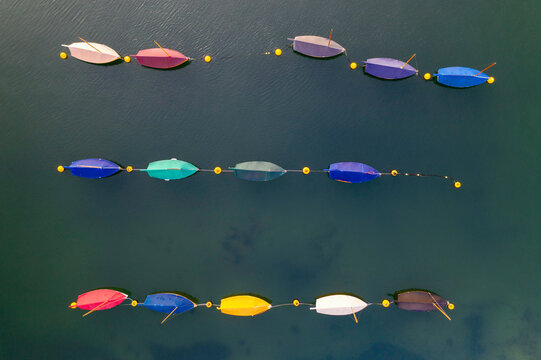 Aerial image of colourful boats moored in a harbour, Cornwall