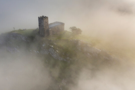 St. Michael de Rupe Church on the summit of Brentor on a misty September morning, Dartmoor, Devon