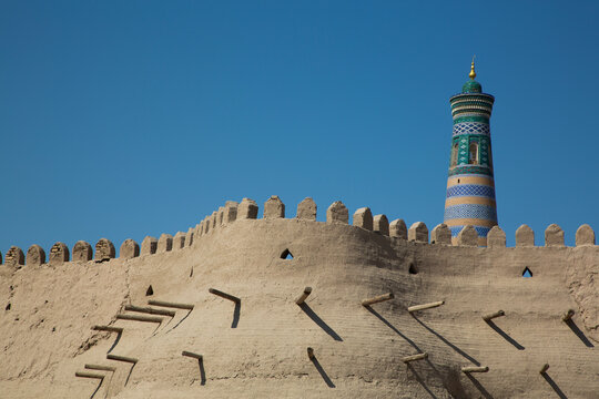 Fortress Wall, Islam Khoja Minaret in the background, Ichon Qala (Itchan Kala), UNESCO World Heritage Site, Khiva, Uzbekistan