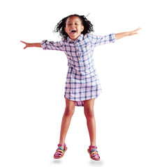 A happy African girl, jumps with curly hair to celebrate and dancing in a studio. Biracial child...