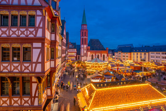 View of carousel and Christmas Market stalls at dusk, Roemerberg Square, Frankfurt am Main, Hesse, Germany