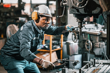 Fototapeta na wymiar Engineering technicians use various hand tools and equipment to perform regular maintenance by inspecting, testing, and repairing machinery and engines to ensure they stay in standard condition.