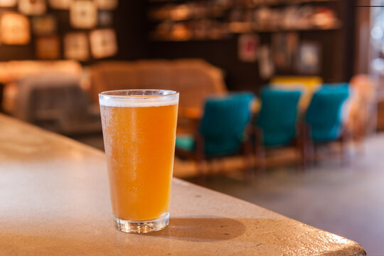 Pot of beer on the counter in a pub