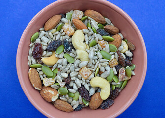 Mixed seeds with fruit and nuts in a bowl