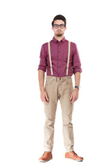 Fototapeta premium Nerdy man, serious face with hipster fashion standing awkwardly with arms on his sides. Funky dressed gentleman wearing suspenders, smart guy with blank stare isolated on a transparent background