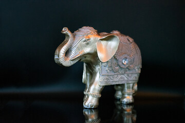 elephant figurine isolated on a black background