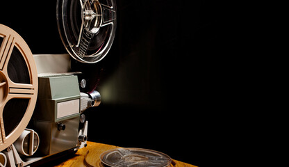 film projector on a black background with dramatic lighting - super 8mm