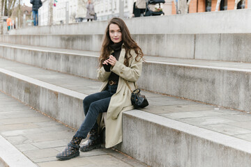 Young beatiful woman portrait in the historical city centre of Ljubljana in trendy outfit