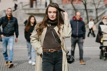Fototapeta premium Young beatiful woman portrait in the historical city centre of Ljubljana in trendy outfit