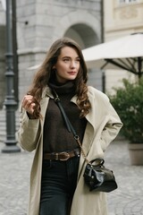 Young beatiful woman portrait in the historical city centre of Ljubljana in trendy outfit