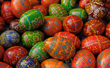 Fototapeta na wymiar Beautiful colorful decor for Easter. Traditional Easter painted colorful eggs. Selective focus.