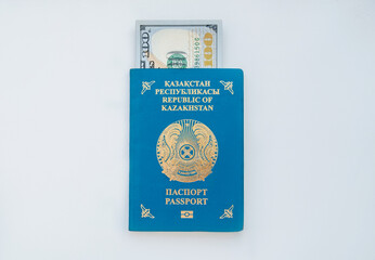 National passport Republic of Kazakhstan. Travel, citizenship, relocation, immigration or bribe concept. Dollars in the passport