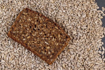Black rye bread cut into chunks with sunflower seeds