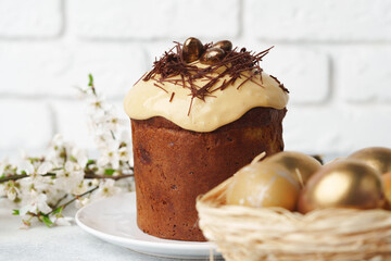 Easter cake with nest decor on gray background