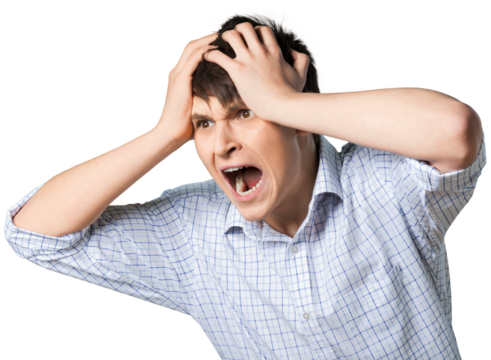 Young man screaming with his hands on his head