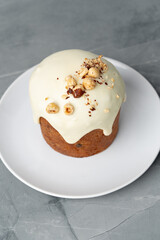 Traditional Easter cake with nuts on gray background