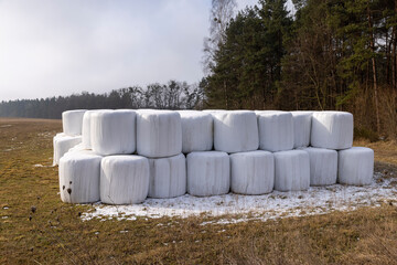 white plastic packaging for hay during storage in winter