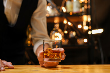Bartender pouring Whiskey, on  bar,