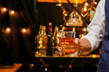 Bartender pouring Whiskey, on  bar,