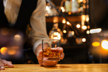 Bartender pouring Whiskey, on  bar,