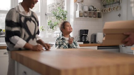 Father bringing family takeaway pizza in boxes