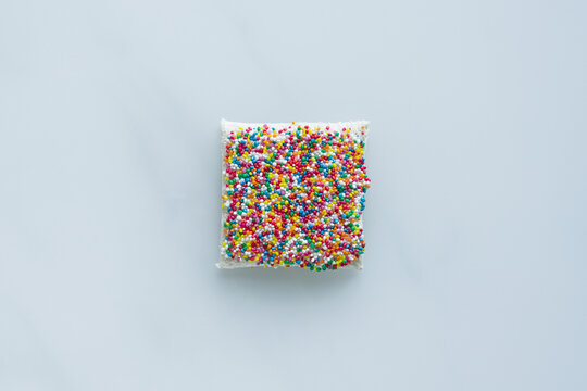 fairy bread overhead on a pale background