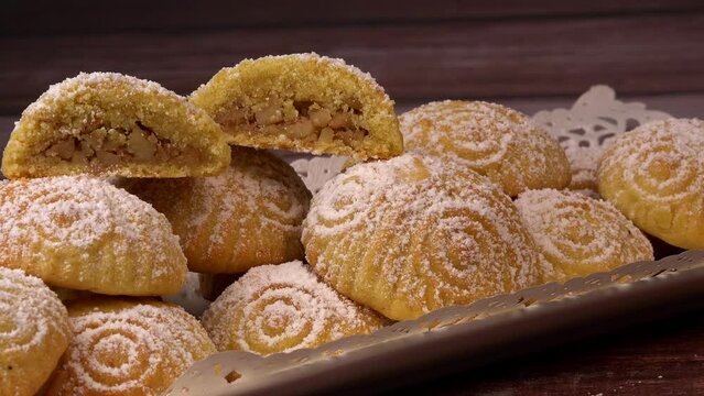 Traditional eid maamoul or mamoul cookies with dates, nuts, and jam, Arabic sweets for Aid al-Fitr and easter, High quality video