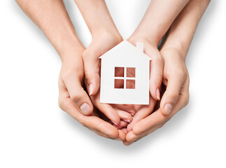 Hands holding house model isolated on white