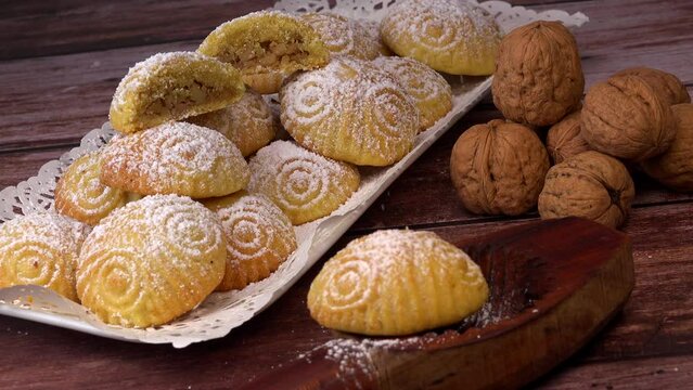 Traditional eid maamoul or mamoul cookies with dates, nuts, and jam, Arabic sweets for Aid al-Fitr and easter, High quality video