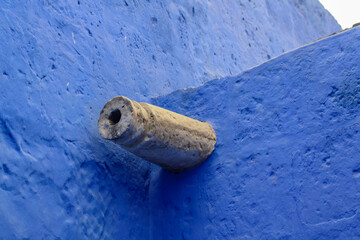 White gargoyle on a blue wall, Arequipa, Peru