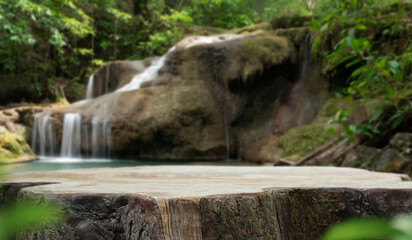 Wood table top podium floor in outdoor waterfall green tropical forest nature background.Natural...