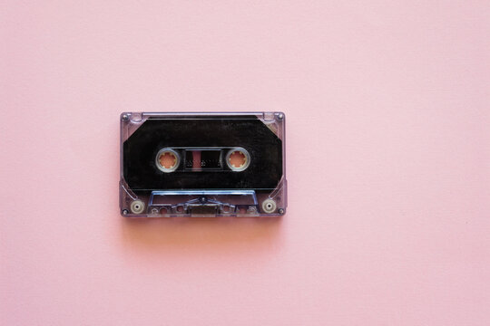 cassette music tape on pink background