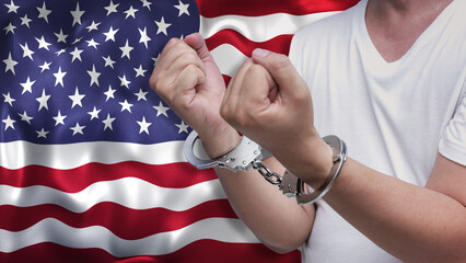 A man getting under arrest in the US. Concept of being handcuffed, detained, incarcerated and...
