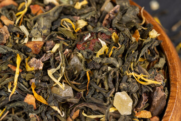 fresh green tea with pieces of fruit and berries