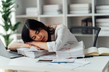 Young woman happy and screaming because of problems with documents in the office.