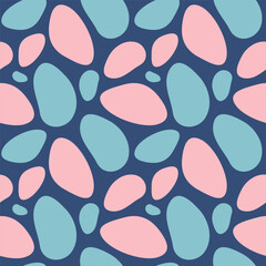 Abstract spotted seamless pattern. Vector illustration of texture with asymmetric simple color spots. Background with blue and pink pebbles.