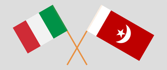 Crossed flags of Italy and The Emirate of Umm Al Quwain. Official colors. Correct proportion