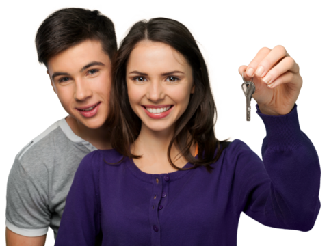 The couple are holding the key of new home. Real estate concept.