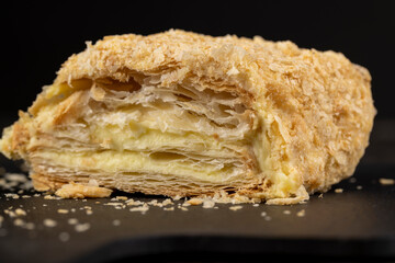 delicious piece of cake with puff pastry and sweet cream