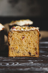 Tasty Easter cake with dried fruits and nuts on a gray texture background
