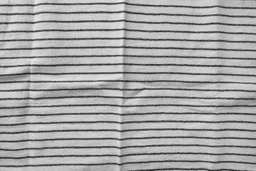 Classic black and white striped kitchen towel texture. Fabric textile background with visible weave...