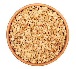 Chopped and roasted hazelnut in clay pot isolated on white, top view
