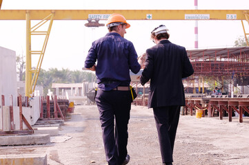 Team of construction engineers inspecting at the construction site. Engineer concept.