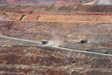 two dump trucks fully loaded drive out of the mine, aerial view, super pit, Kalgoorlie, Boulder, Goldfields, Western Australia, Australia, Ozeanien