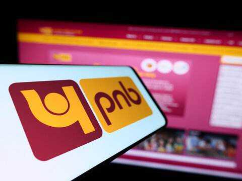 Stuttgart, Germany - 04-01-2023: Mobile phone with logo of Indian company Punjab National Bank (PNB) on screen in front of website. Focus on center-left of phone display.